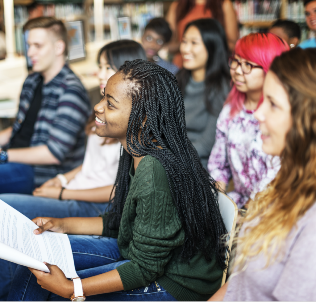 College student participates in class discussion thanks to pell grants.